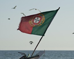 green red and yellow flag on boat during daytime